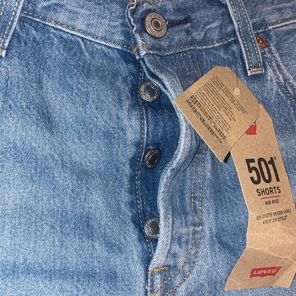 Selling; 501 Levi’s shorts; non stretch; size 29; medium denim color